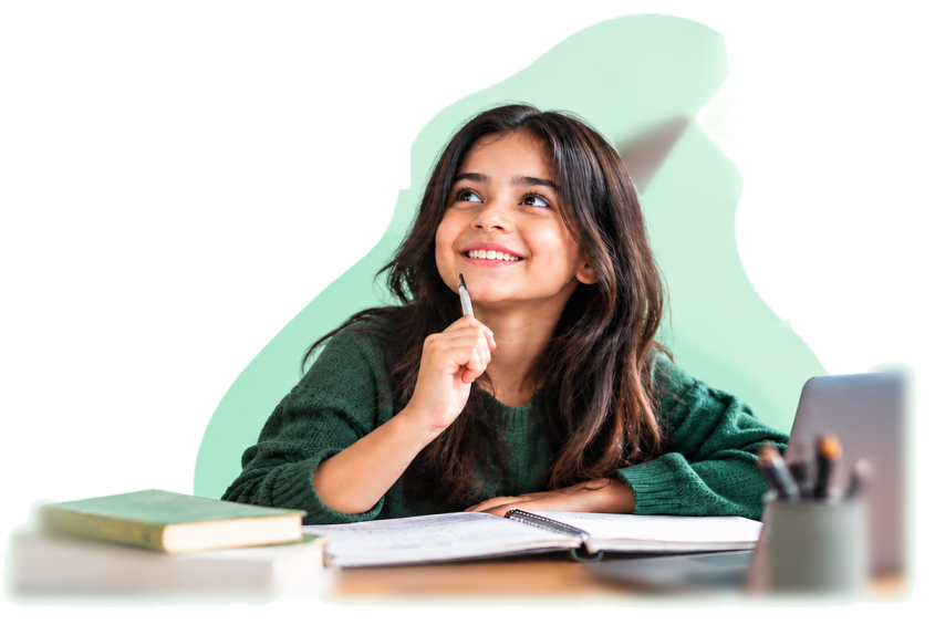 A smiling girl holding a pen, thinking while studying at her desk